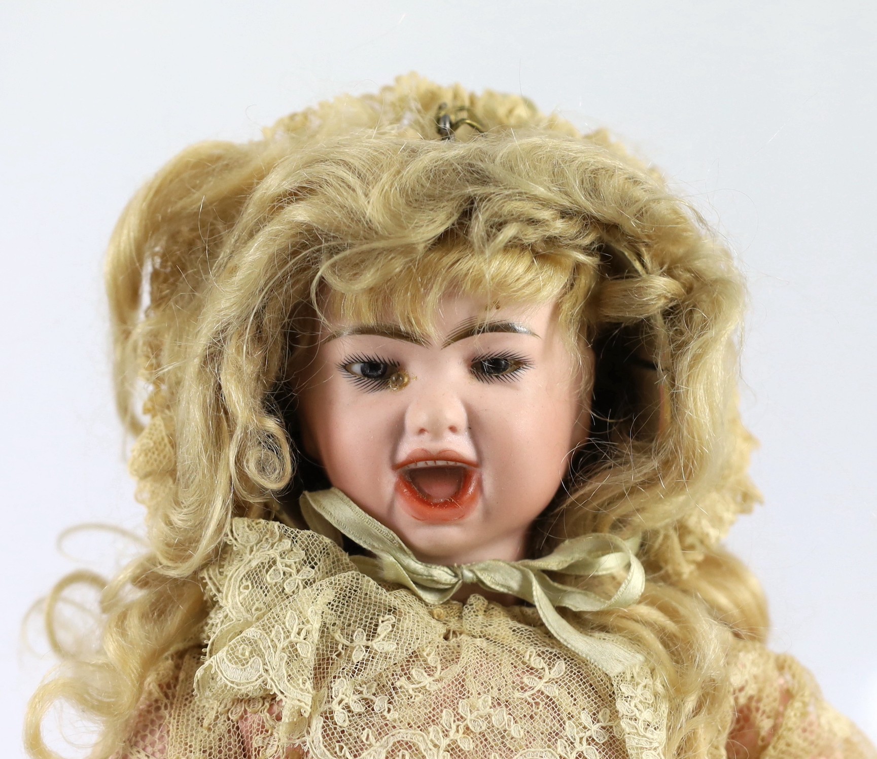 A fine and rare Jumeau pressed bisque two-faced doll, French, circa 1885, 18in.